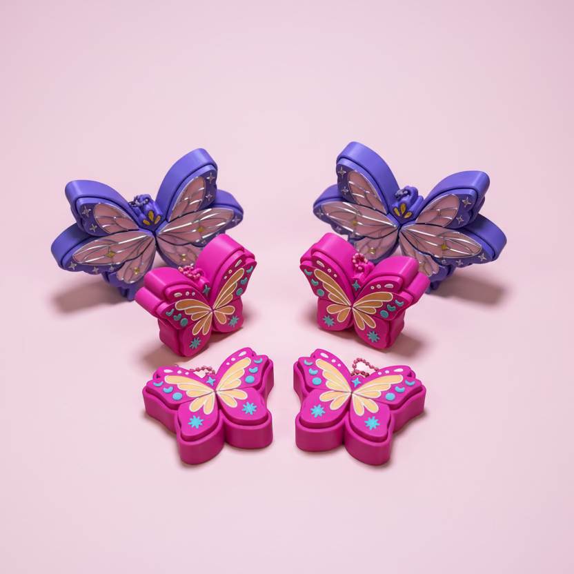 Butterfly-shaped pink and purple objects on a pink surface