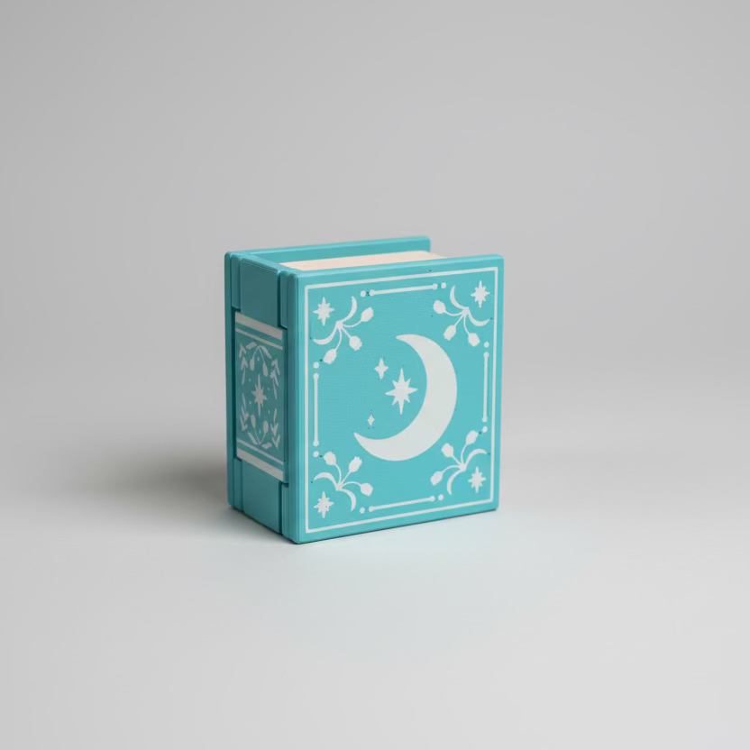 Small decorative box with a moon design on a grey surface