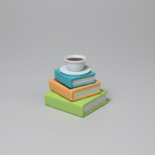 Stack of 3d printed colorful books with a white cup on a gray background