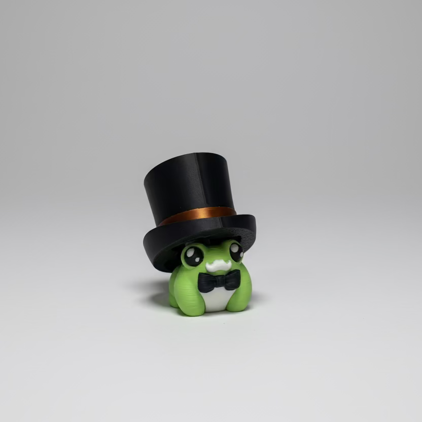 Green toy figure with a black top hat on a grey surface