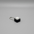 Black keychain with single white clicker button