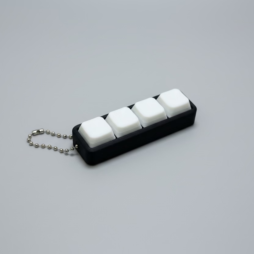black keychain with 4 white clicker buttons